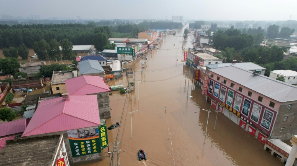 Streets become rivers as Beijing records heaviest rain in 140 years