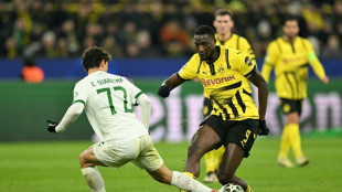 Dortmund ease into Champions League last 16 after Sporting stalemate