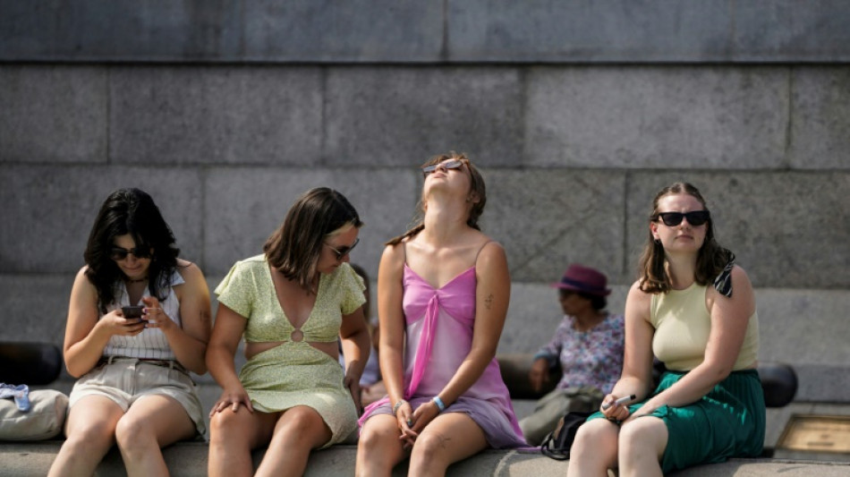 Britons desperate to cool off as mercury hits historic 40C