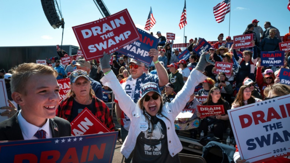 Trump sounds dark tone at rally, Harris 'ready' for debate