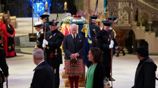 Crowds queue through the night to pay respects to queen