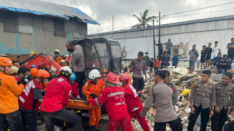 Indonesia rescuers search rubble after mini-market collapse kills 5