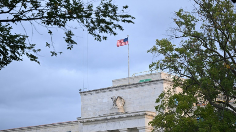 Dow edges down from record as some eye a smaller Fed rate cut