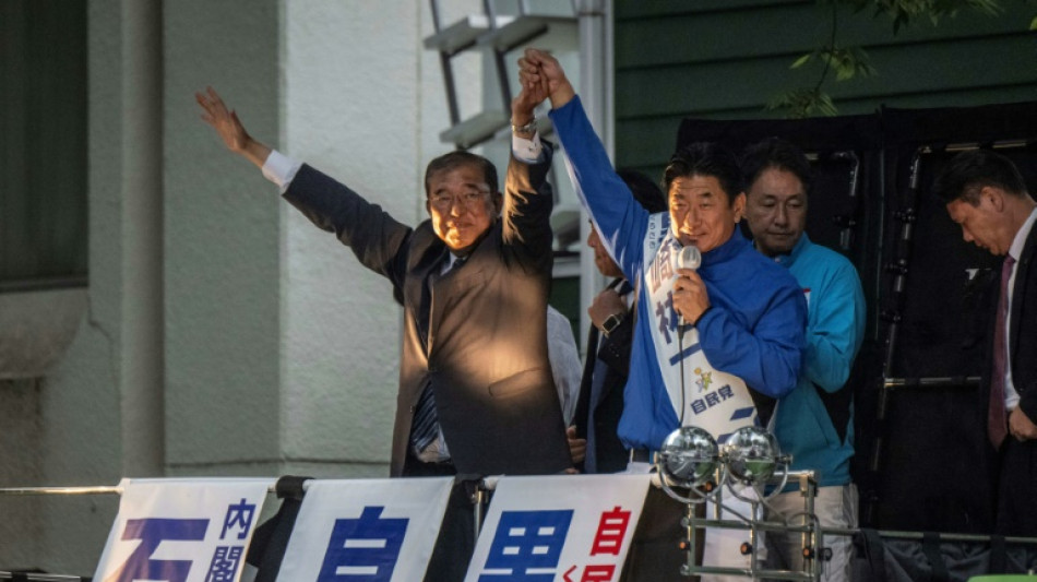 Japan ruling party projected to miss majority in election