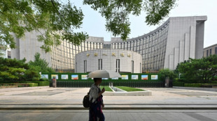 China caps week of 'bazooka' stimulus for ailing economy with rate cut